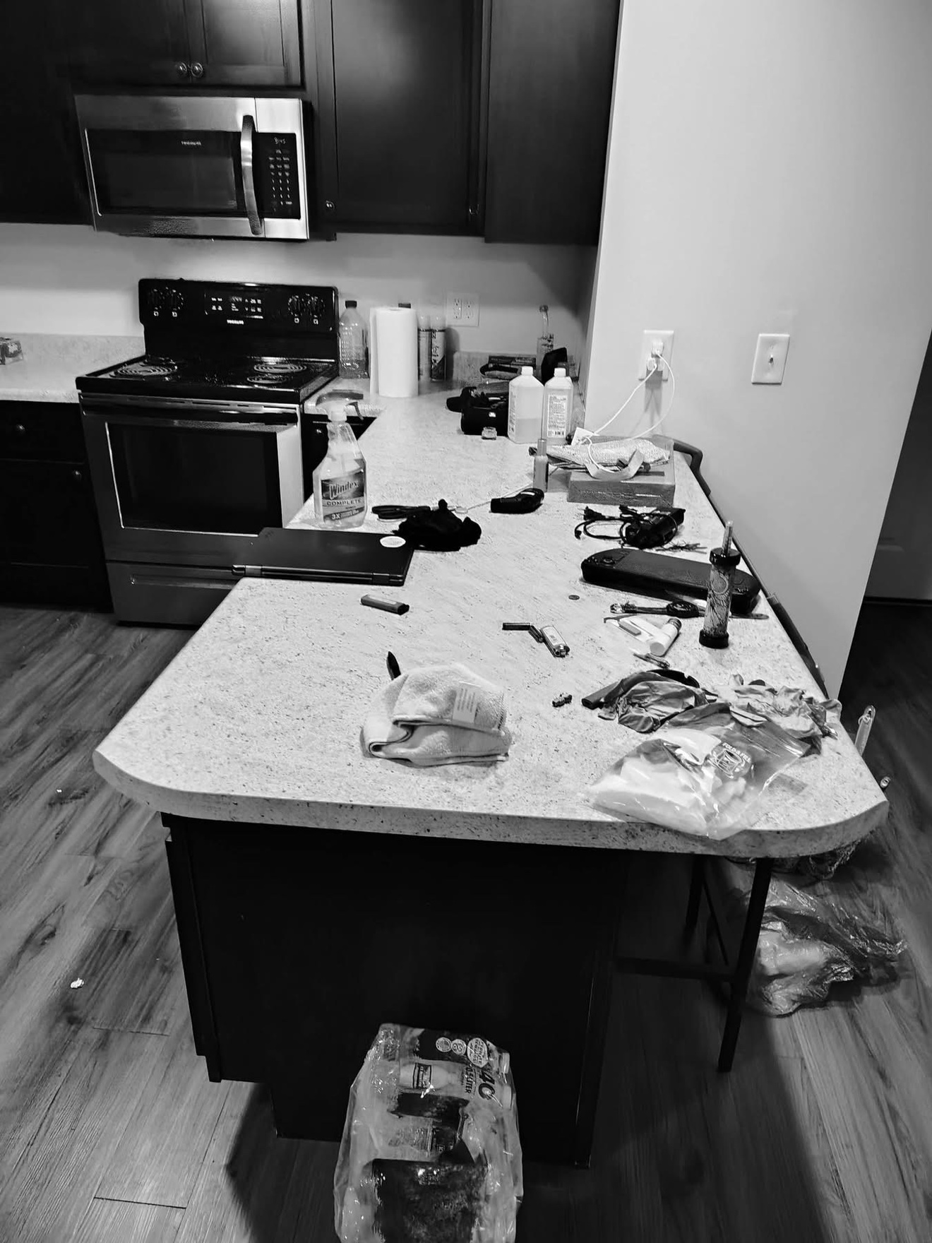 Cluttered kitchen counter before cleaning